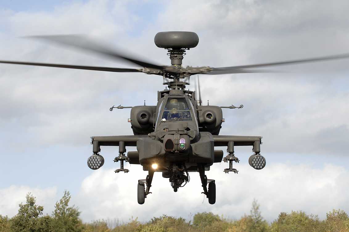 An Army Air Corps Apache attack helicopter takes off during an exercise on the Barton Stacey Training Area (BSTA) near Winchester.  Designed to hunt and destroy tanks, the Apache attack helicopter has significantly improved the Army's operational capability. Apache can operate in all weathers, day or night and detect, classify and prioritise up to 256 potential targets in a matter of seconds. It carries a mix of weapons including rockets, Hellfire missiles and a 30mm chain gun. In addition to the distinctive Longbow Radar located above the rotor blades, this aircraft is equipped with a Day TV system, Thermal Imaging sight and Direct View Optics. Defensively it possesses a state of the art fully integrated Defensive Aid Suite.